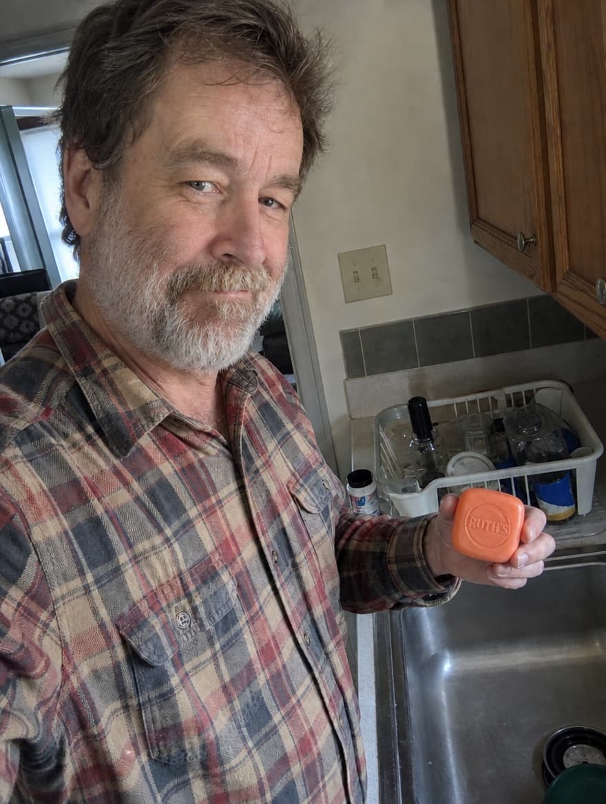 Dennis holding the soap bar